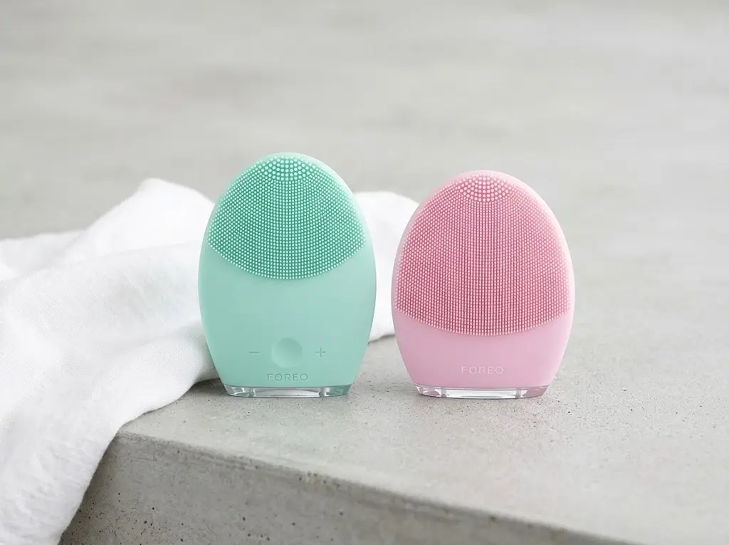Minimalist beauty product shot comparing FOREO LUNA 2 and LUNA 3 devices.