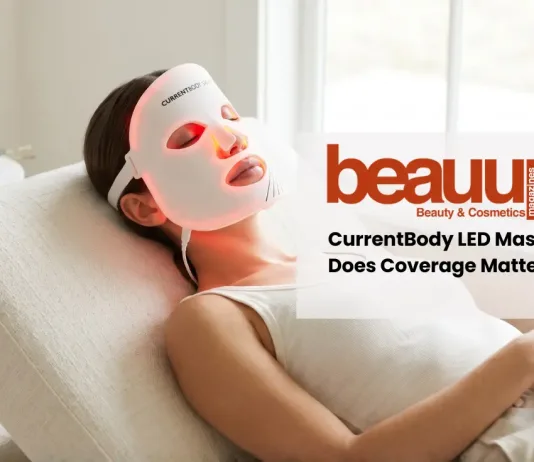 Editorial photo of relaxed woman wearing glowing red light currentbody led mask in luxury home setting.