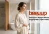 Radiantly firm skin on a confident woman in a luxury minimalist spa, showing body contour consistency.
