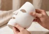 Macro product photo emphasizing the flexible silicone material of the currentbody skin led light therapy face mask.
