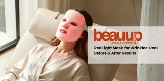 Woman wearing an LED face mask for wrinkles with a soft red glow in a luxury minimalist setting.