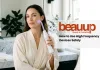 How to Use a High Frequency Wand at Home (Without Damaging Your Skin) A serene editorial photograph of a woman using a luxury high frequency wand at home.