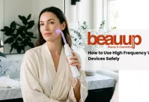 How to Use a High Frequency Wand at Home (Without Damaging Your Skin) A serene editorial photograph of a woman using a luxury high frequency wand at home.