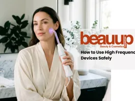 A serene editorial photograph of a woman using a luxury high frequency wand at home.