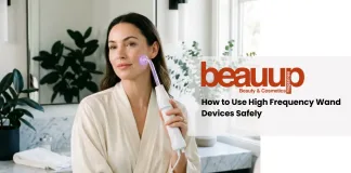 A serene editorial photograph of a woman using a luxury high frequency wand at home.