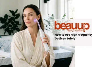 A serene editorial photograph of a woman using a luxury high frequency wand at home.